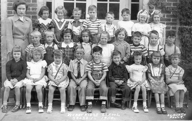 1950 - Wheat Ridge School - First Grade. Back row, left to right: Teacher Miss Dye, Unknown, Unknown, Unknown, Unknown, Keith Watson, Unknown, Unknown, Irma Johnson. Middle row, left to right: Paul Elliott?, Unknown, Jerrie Belec, Joyce Bishop, Barb Tanne