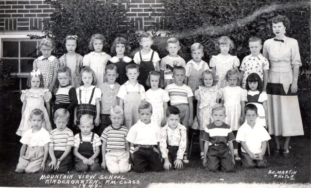 1949 - Mountain View School Kindergarten P.M. Class. Back row left to right: Unknown, Jeanette Hladek(?), Claudia Mitchell, Holly Hutson(?), Alvin/Carl?, John Pettit, Stanley Carne, Unknown, Ron Ottercrans?, Teacher Mrs. Gravum. Middle row, left to right: